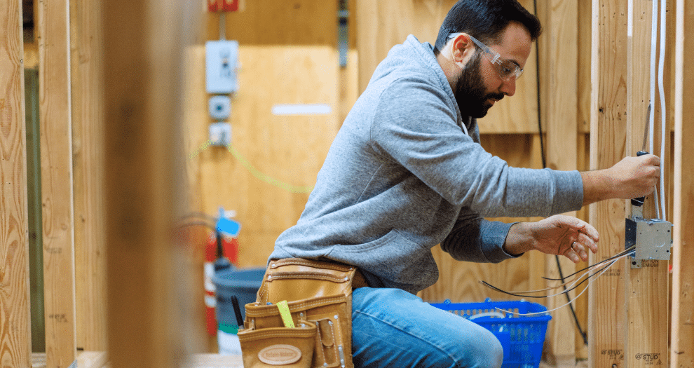 a skilled trades student in the lab hands-on labs at NEIT