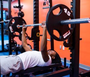 Student lifting weights