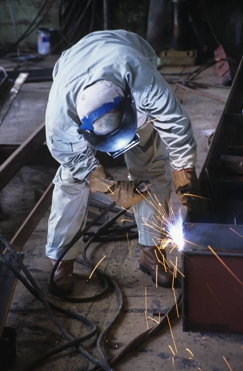 guy welding joints together