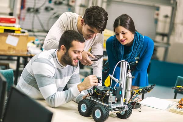 A team working on a small robot