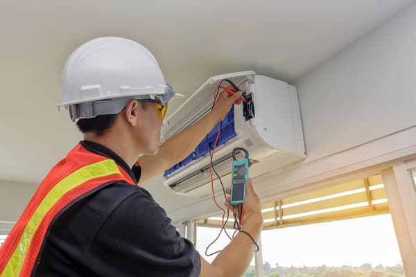 Technician checking an Air Conditioner