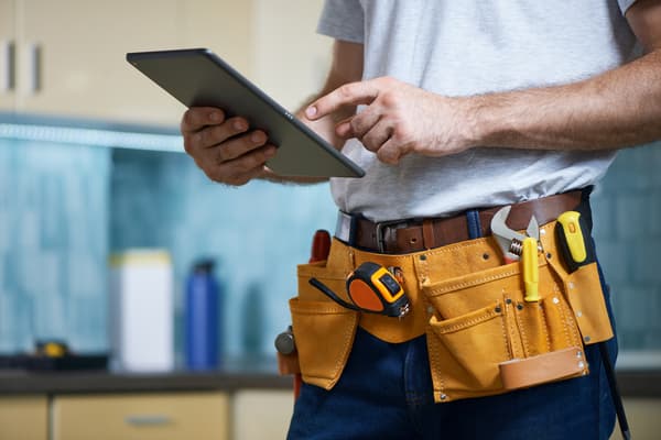 repairman wearing a tool belt