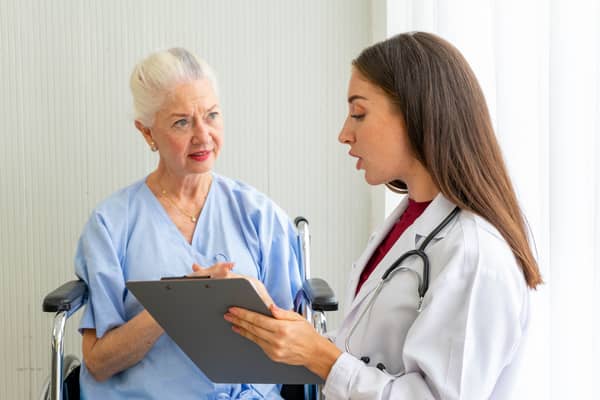 A registered nurse talking to patient