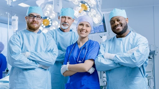 Modern surgical team posing at the surgery room